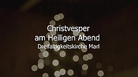 Verschwommene Weihnachtslichter mit deutschem Text für die Christvesper.